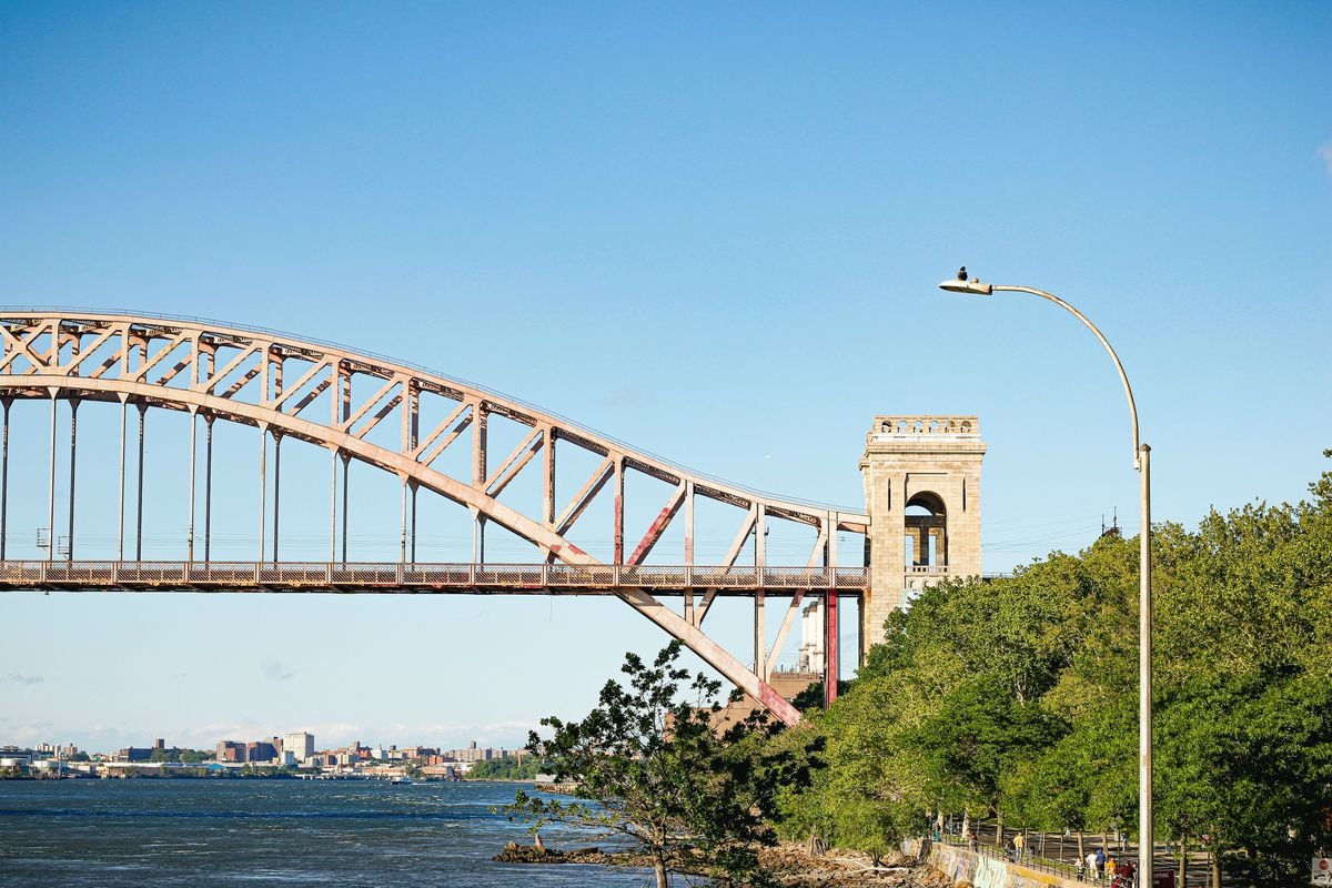 The Hell Gate Bridge arch seen from Astoria Park on a clear day