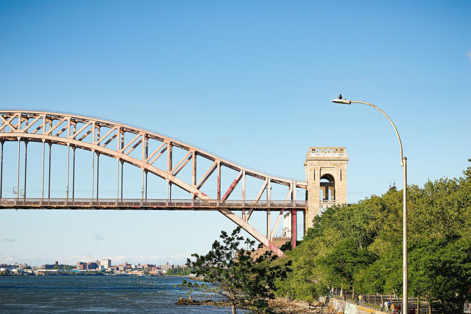 The Hell Gate Bridge arch seen from Astoria Park on a clear day